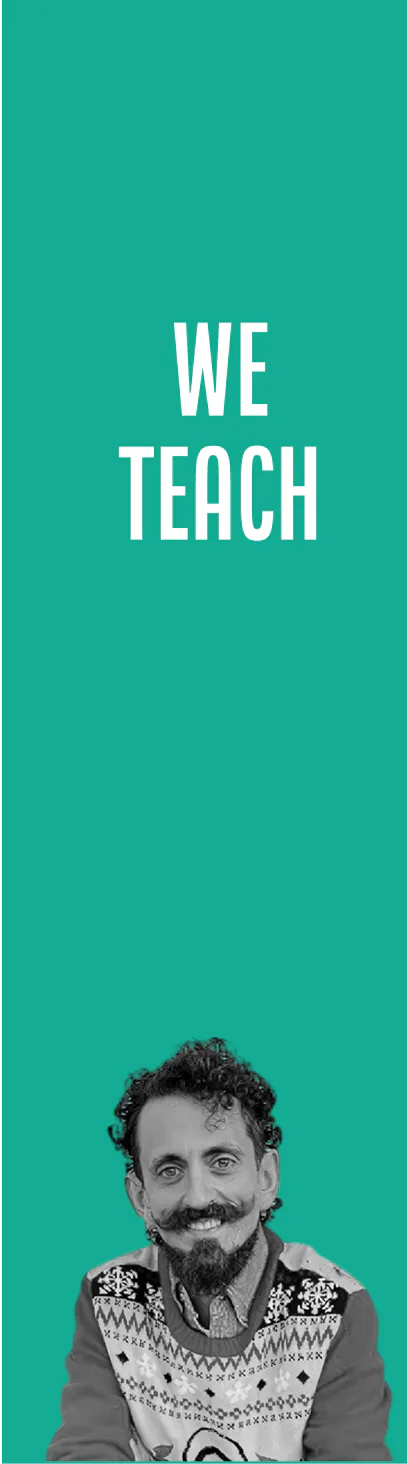 Smiling man with curly hair, mustache, and beard wearing a patterned sweater below the text 'WE TEACH' on a teal green background.